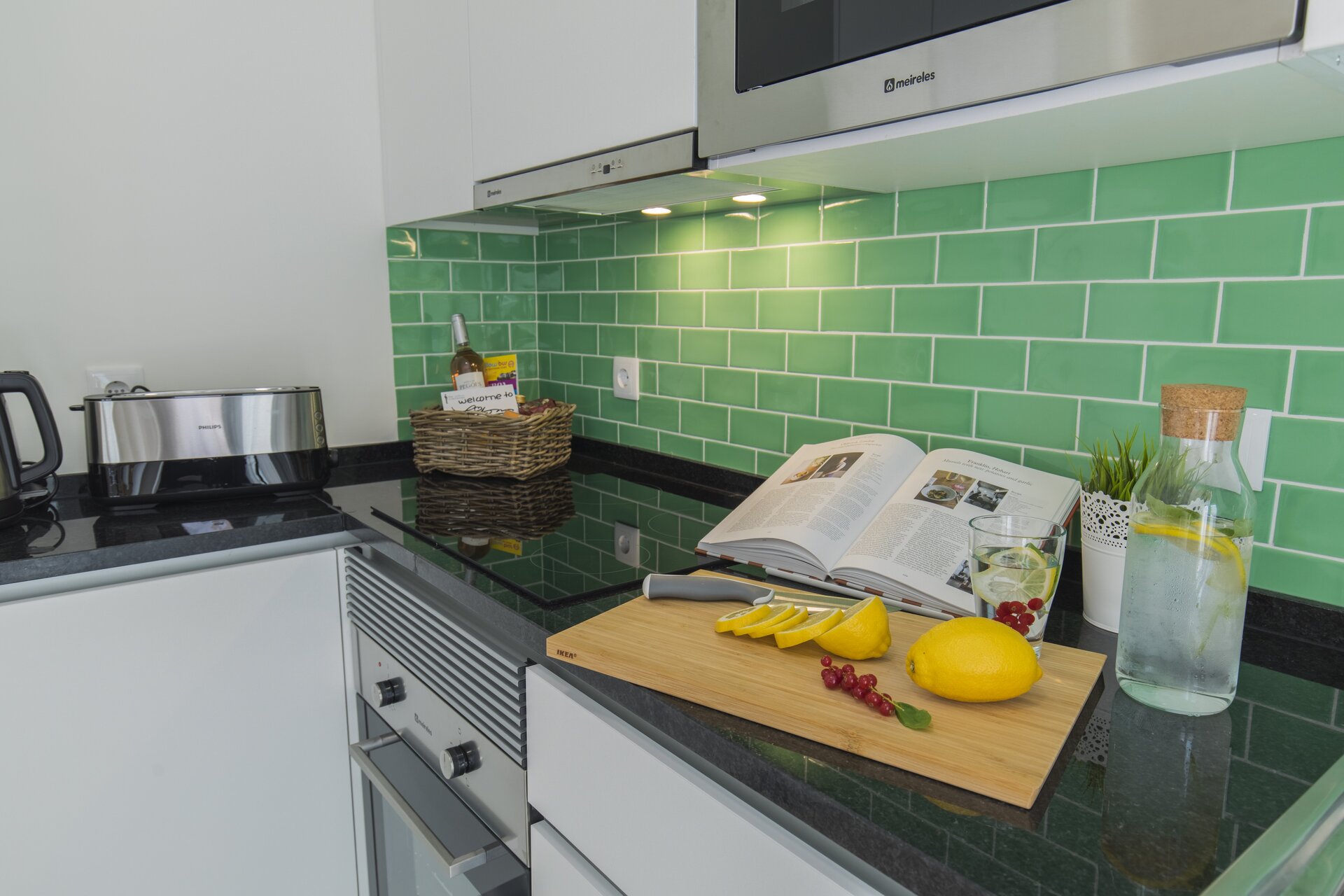 Modern kitchen with green tile backsplash